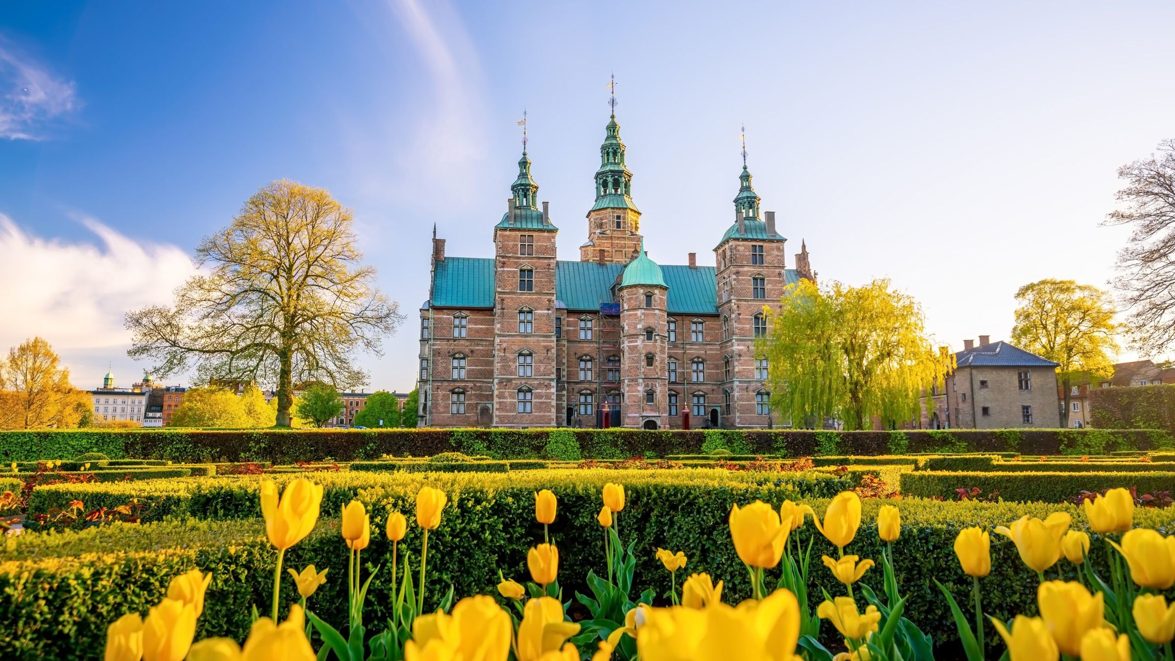 Rosenborg Castle Gardens In Copenhagen Denmark With Blue Sky