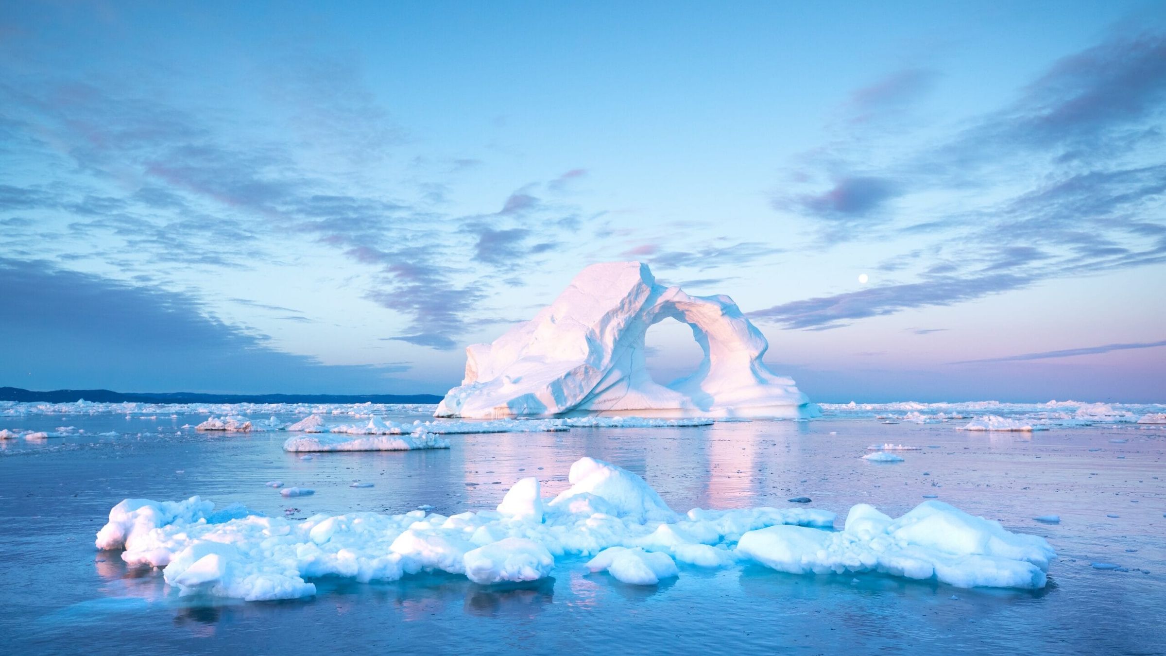 Photogenic And Intricate Iceberg With A Hole Under An Interesting